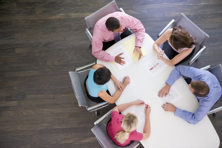 stockfresh_95289_five-businesspeople-at-boardroom-table_sizeS
