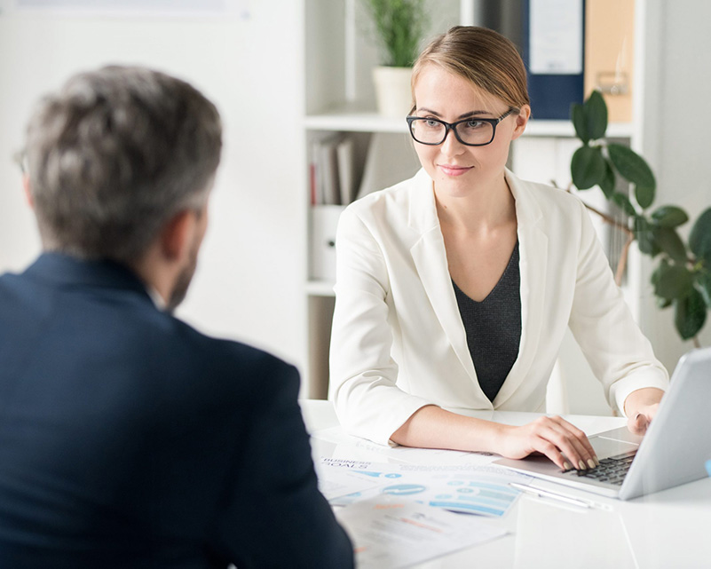 Two people engaging with each other in a work environment