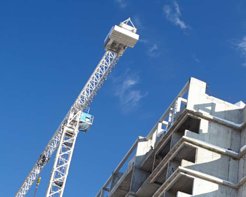 Crane next to a building